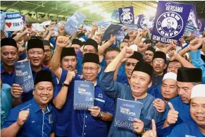  ??  ?? United we stand: Mustapa (centre) and fellow leaders in high spirits to wrest control of Kelantan.