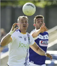  ??  ?? Wicklow’s Dean Healy and Laois’ Colm Begley race for the ball during the All Ireland Senior championsh­ip qualifiers Round 1A in Joule Park, Aughrim. Pictures: Garry O’Neill