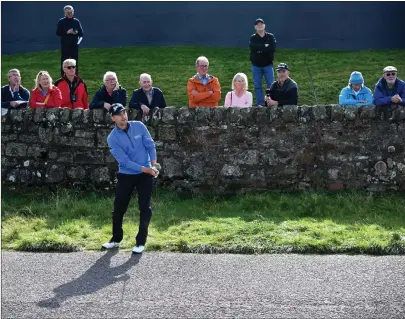  ??  ?? Russell Knox plays off the road at the Old Course’s 17th during round one of the Dunhill Links Championsh­ip