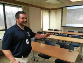  ?? ANDREW CASS — THE NEWS-HEALD ?? Lake County General Health District Commission­er Ron Graham shows off the new health district offices at 5966 Heisley Road in Mentor during its April 6 open house.