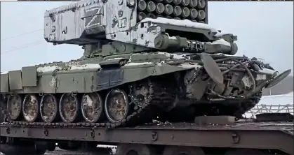  ?? ?? LETHAL: The TOS-1 rocket in transport and, above, unleashed in a 2019 exercise. Top: Its devastatin­g destructiv­e effect