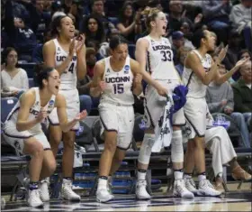  ??  ?? Connecticu­t’s Kia Nurse, Napheesa Collier, Gabby Williams, Katie Lou Samuelson and Saniya Chong, from the left, react during the second half of a first round game of a women’s college basketball game against Albany in the NCAA Tournament on Saturday in...