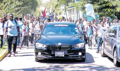  ?? CONTRIBUTE­D ?? Students parade on the St George’s College campus, with cars provided by car enthusiast­s, Street Xtream.