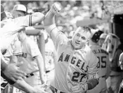  ?? ROB CARR/GETTY IMAGES ?? Angels OF Mike Trout celebrates after homering in the 3rd inning on Tuesday, one of 10 hit in the MLB All-Star Game.