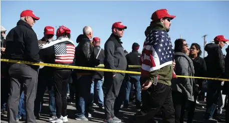  ?? GETTY IMAGES ?? FEELING NOT SO GREAT: Supporters wear MAGA hats while waiting to attend a rally for President Trump in El Paso, Texas, on Feb. 11.