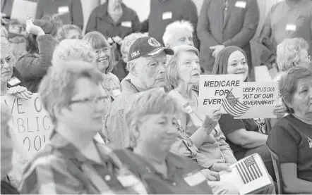  ?? Melissa Phillip / Houston Chronicle ?? People listen Saturday during an event billed as a town hall of the constituen­ts of the 8th Congressio­nal District held at Conroe Tower. The district is represente­d by Republican Kevin Brady.