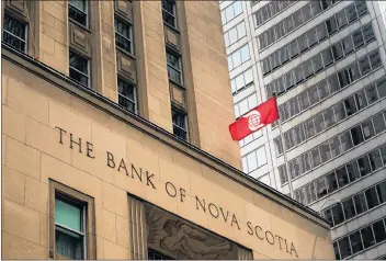  ?? CP PHOTO ?? The Bank of Nova Scotia building is shown in the financial district in Toronto last year.