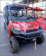  ?? PHOTOS BY RANDY HOEFT/ YUMA SUN ?? LEFT: YUMA FIRE DEPARTMENT CHIEF Steve Irr (center) talks with Chris Miller (left) and Miller’s sister Lisa Meyer, who own Firehouse Subs in Yuma, about the new utility terrain vehicle (UTV) donated to Yuma Fire Department with a grant from the...