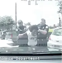  ?? AUSTIN POLICE DEPARTMENT ?? In this June 2015, frame from dash cam video, Breaion King is held by officers during a traffic stop in Austin, Texas. The footage released July 21, of the arrest is the latest in a string of videos showing tense encounters between police and blacks...