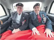  ?? ?? WAR HEROES: Bill Gladden, left, with fellow veteran Ted Pieri sit in the back of a cab ahead of a Taxi Charity trip to northern France.