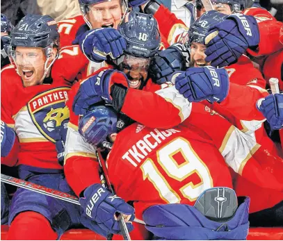  ?? USA TODAY SPORTS ?? Florida Panthers left-wing Matthew Tkachuk celebrates with teammates May 24 after scoring the game-winning goal against the Carolina Hurricanes during the third period in Game 4 of the Eastern Conference finals of the 2023 Stanley Cup playoffs at FLA Live Arena.