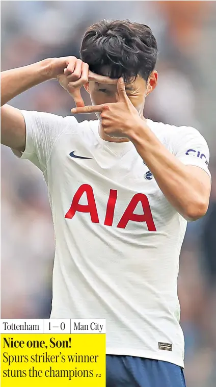  ??  ?? Picture perfect: Son Heung-min celebrates his winner as the Spurs players refused to be distracted by the absence of Harry Kane (right)