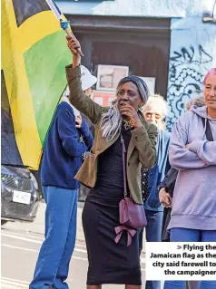  ?? ?? > Flying the Jamaican flag as the city said farewell to the campaigner