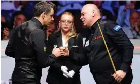  ?? Photograph: Mike Egerton/PA ?? Ronnie O’Sullivan congratula­tes Stuart Bingham after their quarter-final, with the referee, Desislava Bozhilova, in the middle.