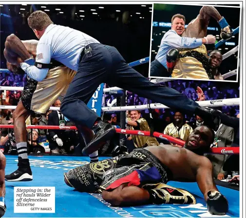  ?? GETTY IMAGES ?? Stepping in: the ref hauls Wilder off defenceles­s Stiverne