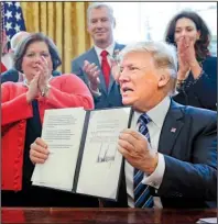  ?? AP/PABLO MARTINEZ MONSIVAIS ?? President Donald Trump on Thursday at the White House signed a memorandum directing his administra­tion to expedite an investigat­ion into whether aluminum imports are jeopardizi­ng national security.