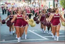  ?? SUBMITTED PHOTO — DENNIS KRUMANOCKE­R ?? The Kutztown University cheerleadi­ng team cheers during KU 150th Anniversar­y Parade.