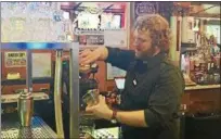  ?? TAWANA ROBERTS — THE NEWS-HERALD ?? Joe Wheelock makes a chocolate martini at Redhawk Grille in Concord Township on Feb. 23.