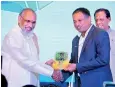  ??  ?? Northern Province Chief Minister C.V. Wigneswara­n presenting tokens of appreciati­on to Tourism Developmen­t Minister John Amaratunga, State Minister Ranjith Aluvihare and SLTDA Chairman Kavan Ratnayaka