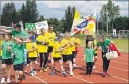  ??  ?? Children in the parade before the primary schools competitio­n