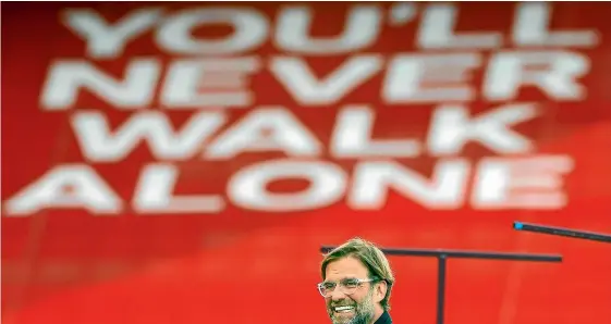  ?? GETTY IMAGES ?? Jurgen Klopp has guided Liverpool back to the summit of English football in his own, distinctiv­e style, attaining legendary status with the team’s fans as the club ended its 30-year title drought.