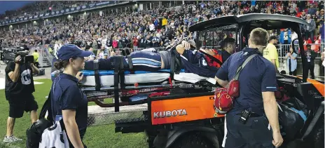  ?? COLE BURSTON/THE CANADIAN PRESS ?? Argonauts quarterbac­k Ricky Ray is taken off the field on a stretcher Saturday during a game at BMO Field.