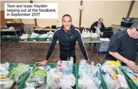  ??  ?? Toon ace Isaac Hayden helping out at the foodbank in September 2017