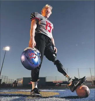  ?? Robert Gauthier Los Angeles Times ?? LOS ALAMITOS HIGH snapper Carson Fox wears a prosthetic device after losing his left leg 18 months ago to a rare form of bone cancer. His team plays Long Beach Poly tonight in the playoffs.