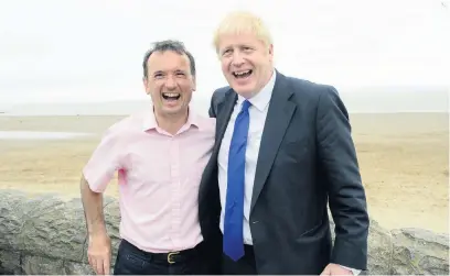  ??  ?? Alun Cairns, pictured with Prime Minister Boris Johnson on a visit Barry Island, held his Vale of Glamorgan seat