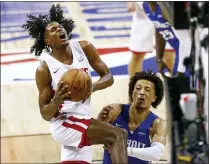  ?? CHASE STEVENS - THE ASSOCIATED PRESS ?? Houston Rockets’ Jalen Green drives to the basket against Detroit Pistons’ Cade Cunningham during the second half of an NBA summer league basketball game Tuesday, Aug. 10, 2021, in Las Vegas.