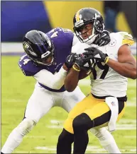  ?? Terrance Williams / Associated Press ?? Steelers wide receiver JuJu Smith-Schuster (19) runs the ball against Ravens cornerback Marlon Humphrey (44) on Nov. 1. Humphrey returned from the reserve/COVID-19 list Wednesday.