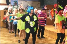  ?? Gina Ender/The Signal (See additional photos at signalscv.com) ?? Tap dancers move in their Alice in Wonderland-themed attire at the Santa Clarita Valley Senior Center’s Mad Hatter’s tea party on Thursday.