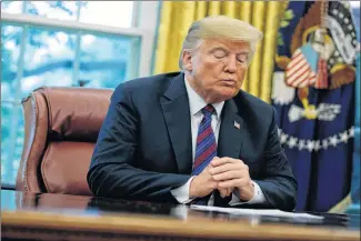  ?? AP PHOTO ?? President Donald Trump talks on the phone with Mexican President Enrique Pena Nieto, last month, in the Oval Office of the White House in Washington.