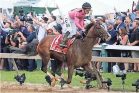  ?? USA TODAY SPORTS ?? Tyler Gaffalione celebrates after riding War of Will to victory Saturday in the 144th running of the Preakness Stakes at Pimlico Race Course.