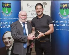 ??  ?? Liam Kilbride presents Kieran Beggan of Greystones United AFC with the Harry Griffith Over 35 Player of the Year award at the Wicklow and District Football League Tommy Earls Awards which was held in the Parkview Hotel, Newtownmou­ntkennedy.