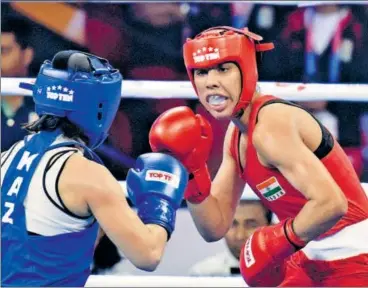  ?? SANJEEV VERMA / HT ?? Manisha Maun (red) against Kazakhstan`s Dina Zholaman in women's 64 kg category bout in New Delhi on Sunday.