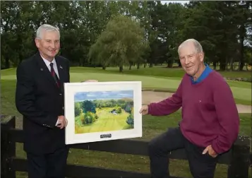  ??  ?? Courtown Golf Club President Vinny Kavanagh presents the winner of his president’s prize, Seamus Grogan, with his beautiful prize.