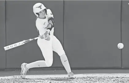  ?? MIKALA COMPTON/AMERICAN-STATESMAN ?? Texas hitter Leighann Goode takes a swing in the April 10 game against Texas State.