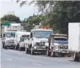  ??  ?? DELAYS: Cars and trucks wait at the base of the Kuranda Range following a crash.