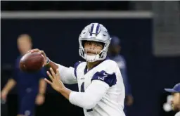  ?? Associated Press ?? Dallas Cowboys quarterbac­k Dak Prescott (4) throws a pass during an NFL football practice Thursday in Frisco, Texas.