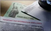  ?? ERIC GAY — THE ASSOCIATED PRESS FILE ?? President Donald Trump’s name is seen on a stimulus check in San Antonio issued by the IRS to help combat the adverse economic effects of the COVID-19outbreak.