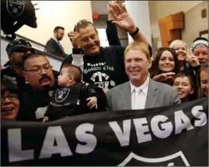  ?? The Associated Press ?? RAIDER RELOCATION: Oakland Raiders owner Mark Davis, center, meets with Raiders fans after speaking at a meeting of the Southern Nevada Tourism Infrastruc­ture Committee on April 28, 2016, in Las Vegas. The Raiders filed paperwork Thursday to move to...