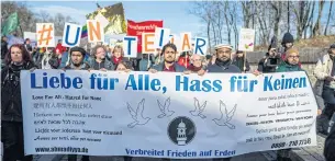  ?? AFP ?? Demonstrat­ors hold a banner on Saturday reading ‘Love for All - Hatred for None’ as they rally in Erfurt, Germany, where far-right lawmakers helped install a new state premier.