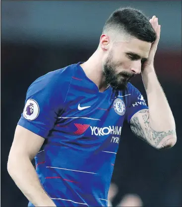  ?? — THE ASSOCIATED PRESS ?? Chelsea’s Olivier Giroud reacts after his team’s 2-0 loss to Arsenal in an English Premier League soccer match on Saturday at the Emirates stadium in London.