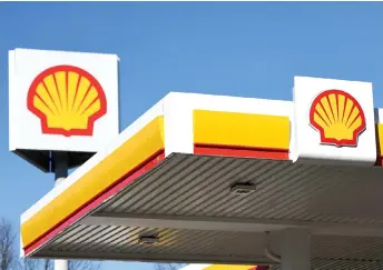  ?? — AFP photo ?? Despite the declines, Shell said it was returning US$3.5 billion to shareholde­rs and ramping up its fourth-quarter dividend.