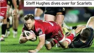  ??  ?? Steff Hughes dives over for Scarlets