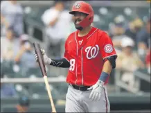  ?? JULIO CORTEZ ?? FILE - In this March 10, 2020, file photo Washington Nationals’ Kurt Suzuki reacts after striking out to Miami Marlins pitcher Caleb Smith during the second inning of a spring training baseball game, in Jupiter, Fla. Just as sure as someone could take advantage of this year’s 60-game Major League Baseball schedule to hit .400, there are bound to be players who end up with much worse stats than they’d like.