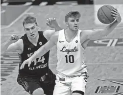  ??  ?? Loyola’s Tom Welch controls the ball as Southern Illinois’ Kyler Filewich defends during the second half Friday in St. Louis.