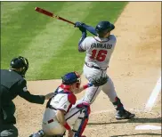  ?? LAURENCE KESTERSON — THE ASSOCIATED PRESS ?? Atlanta Braves Travis d’Arnaud (16) follows through on a home run during the seventh inning of a baseball game against the Philadelph­ia Phillies, Sunday, April 4, 2021, in Philadelph­ia.