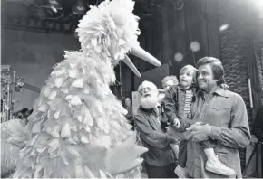  ??  ?? Johnny Cash meets Big Bird on the set of “Sesame Street.”